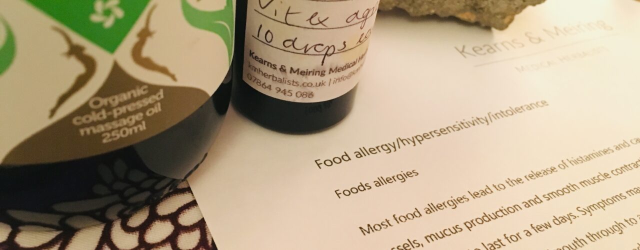 Bottles of massage oil and herbal tincture